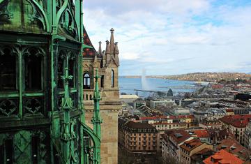 Aerial view of Geneva with St Pierre's Cathedral in the front and the sea in the back.